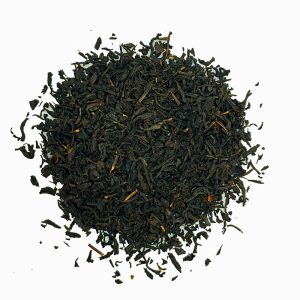 Loose black tea leaves scattered. grand early grey loose leaf tea, black tea, black loose leaf tea, c tea house