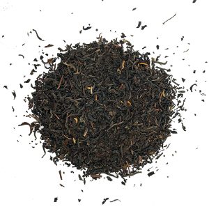 Loose black tea leaves scattered. Russian caravan black loose leaf tea, black tea, c tea house