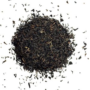 Loose black tea leaves scattered. Vanilla black loose leaf tea, black tea, c tea house